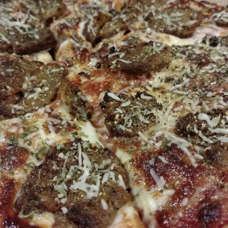 Loaded specialty pizza fresh from the oven
