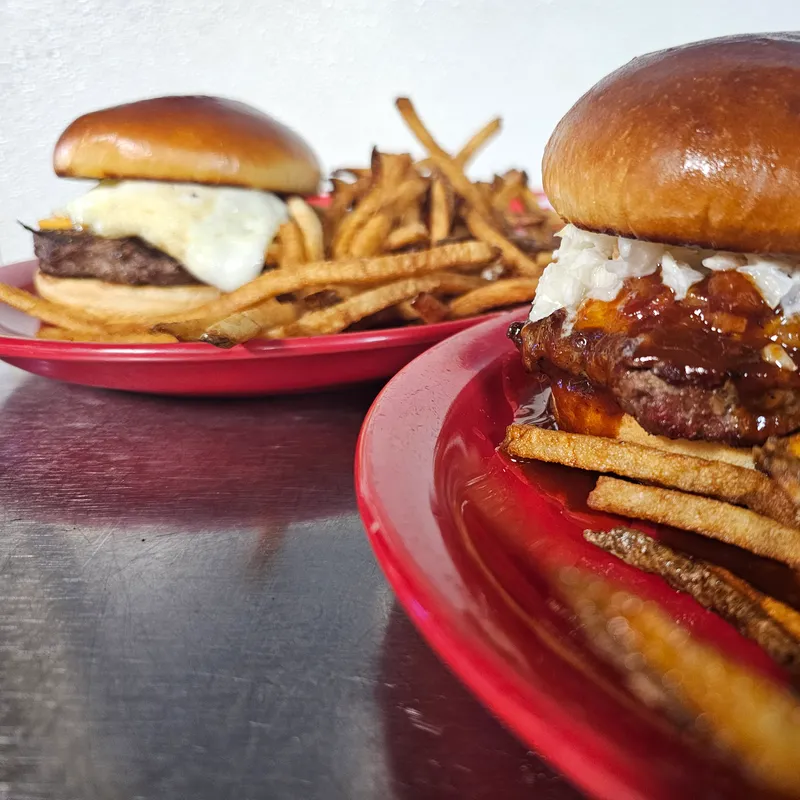 Cheeseburger with a pile of fries