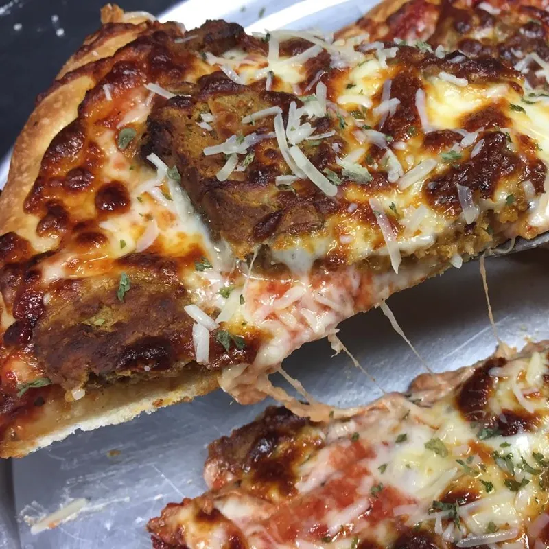 Close-up of a specialty pizza slice