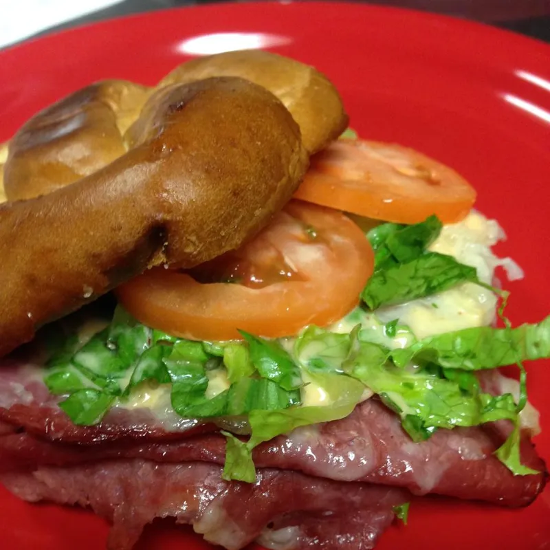 Corned beef sandwich stacked on a bagel