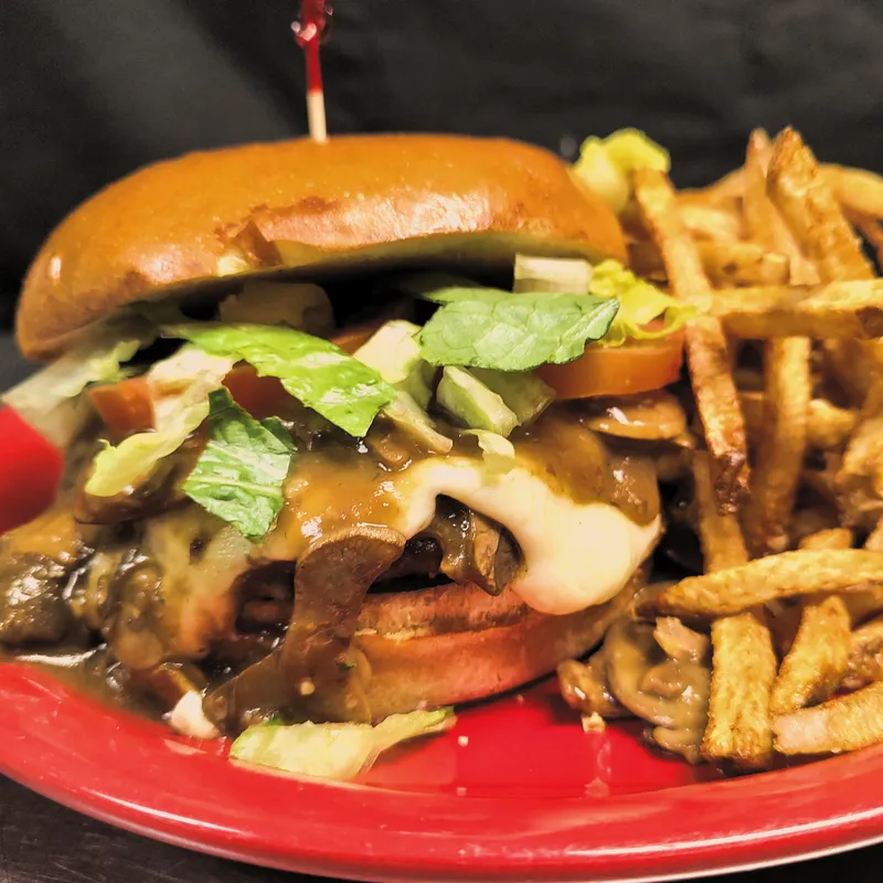 Philly steak sandwich with shoestring fries